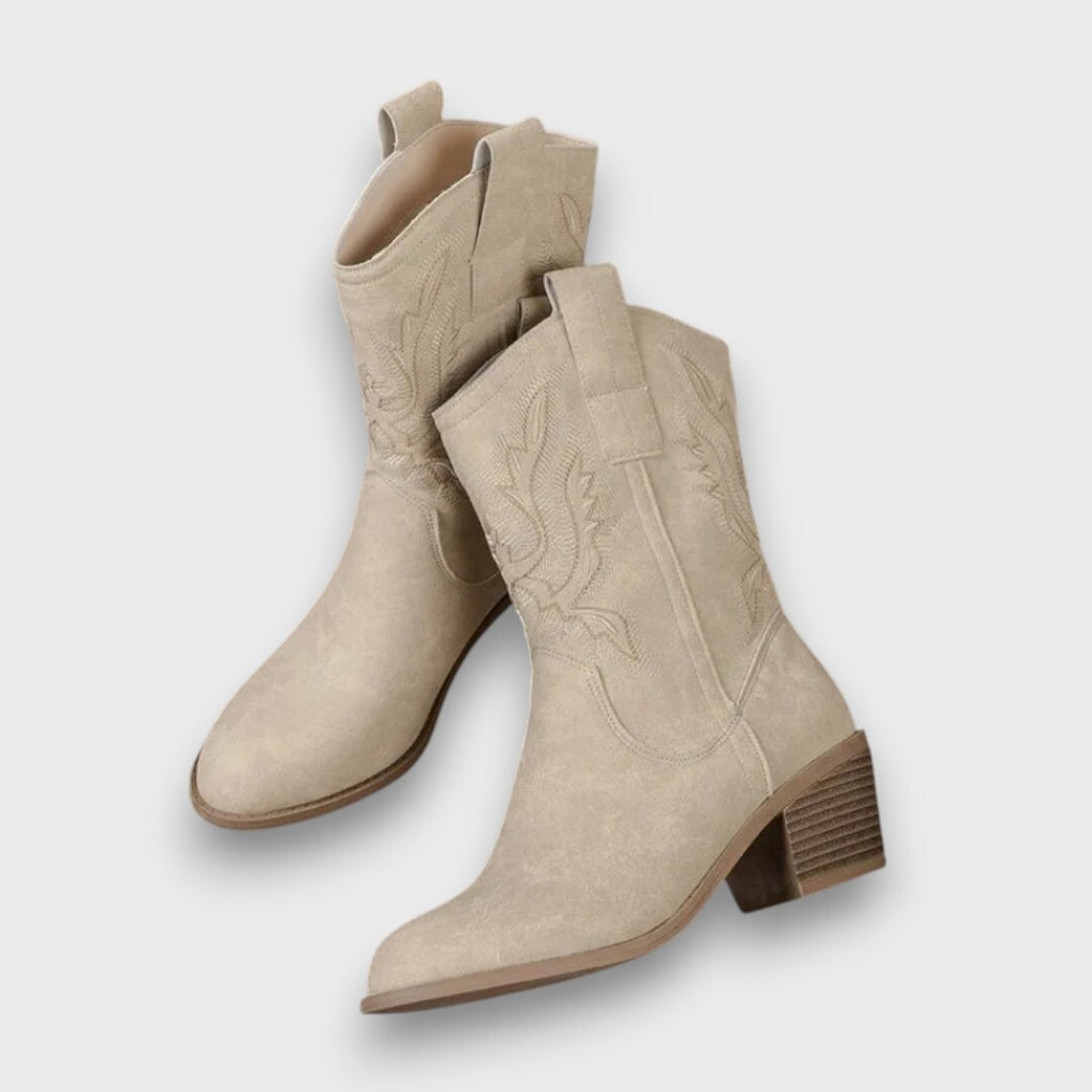 Damsnökängor med mönstrad skaftdesign och klack