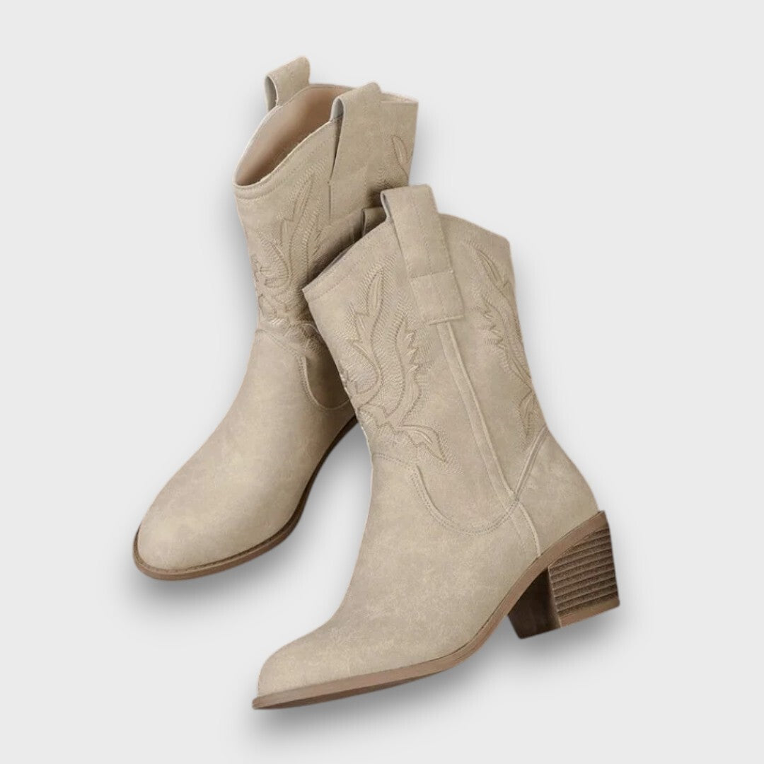 Damsnökängor med mönstrad skaftdesign och klack