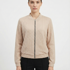 Damjacka med stickat mönster och dragkedja