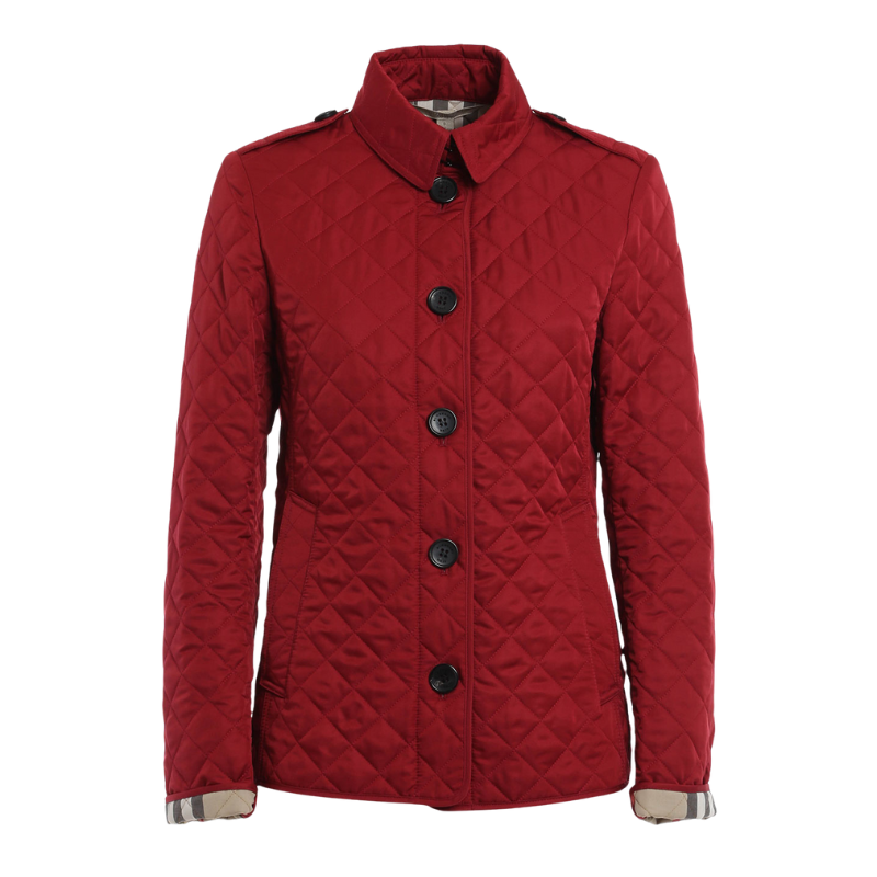 Damjacka med quiltat mönster och knappar